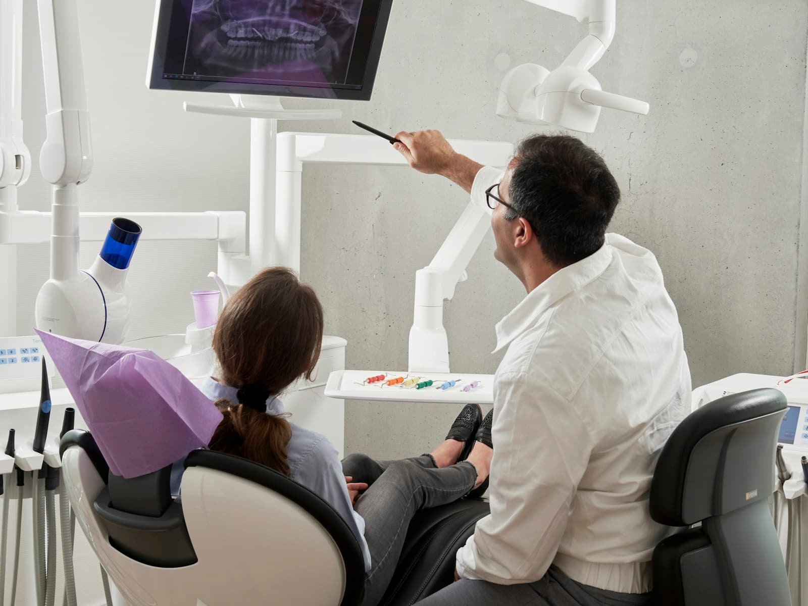 Dentist reviewing digital x-rays with a patient